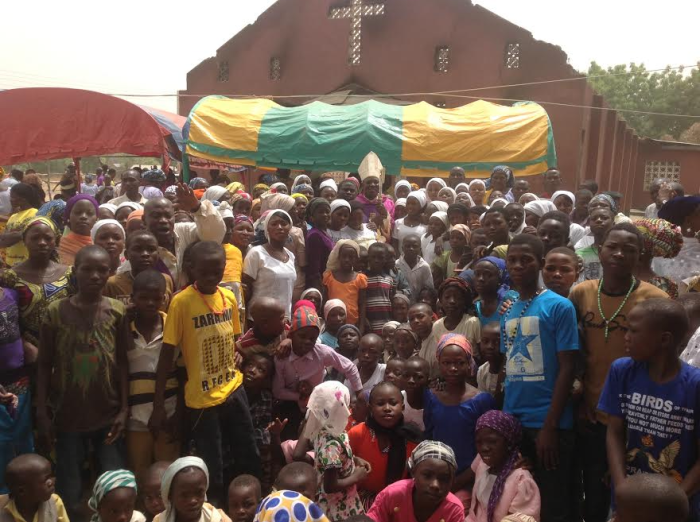 THE RETURNING COMMUNITY IN BETSO WITH THE BISHOP OF MAIDUGURI DURING A CONSOLATION TOUR AFTER THE BOKO HARAM MASSACRE