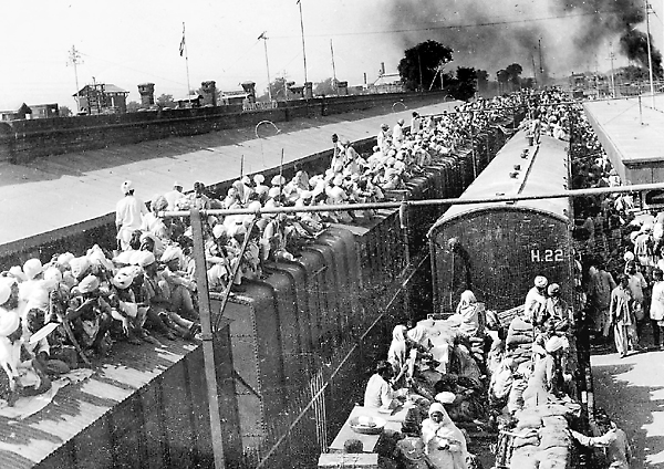MILLENNIUM PHOTO: FREEDOM MOVEMENT, HISTORY'S BIGGEST MIGRATION. TRAIN LOADED TO CAPACITY, INDIA PAKISTAN PARTITION.. ISSUED BY DIRECTORATE OF PUBLIC RELATIONS, EAST PUNJAB. Photo: en.wikipedia.org